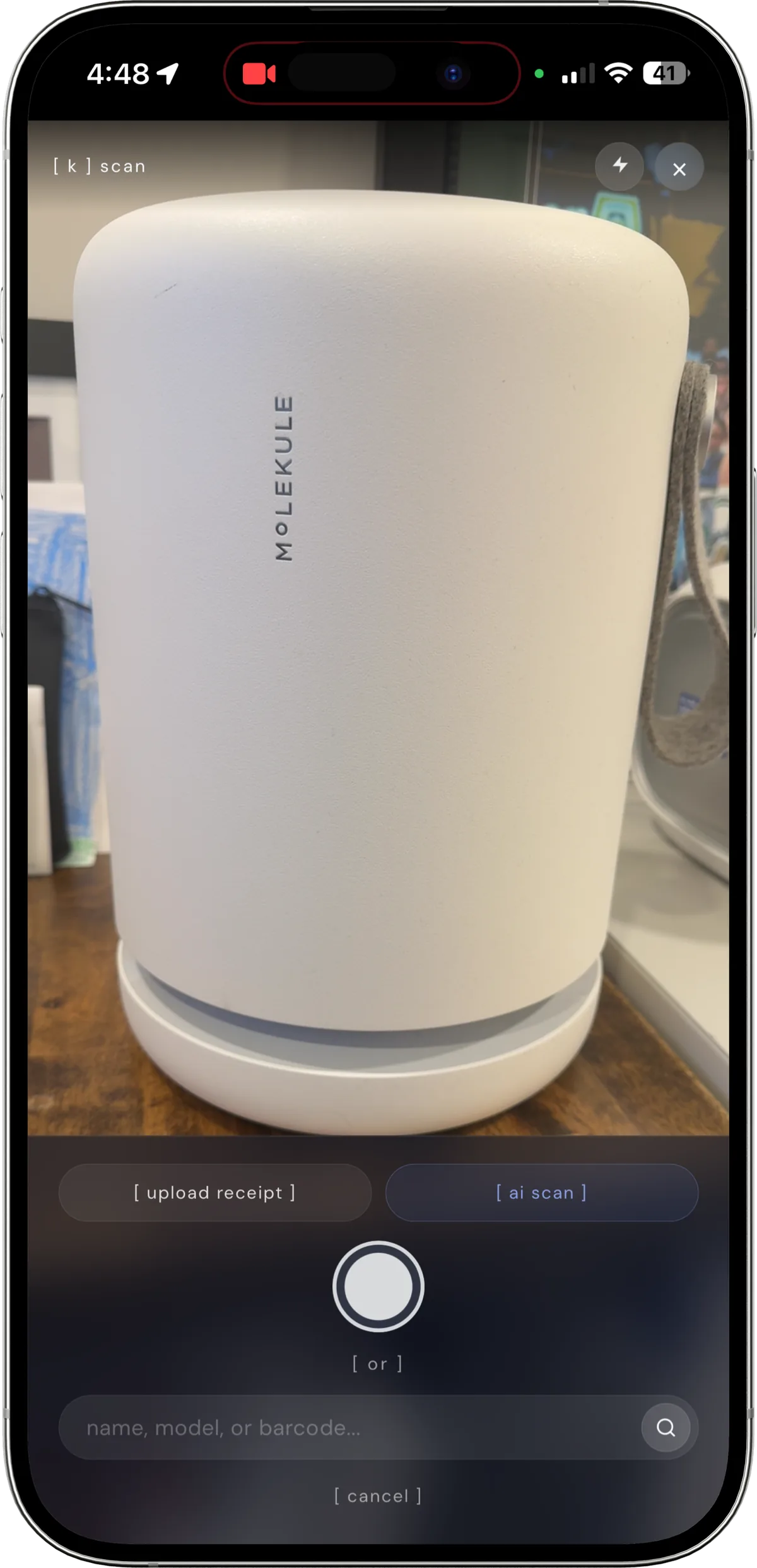 kept's AI capture mode with the camera pointed at an air purifier, showing upload receipt and AI scan buttons
